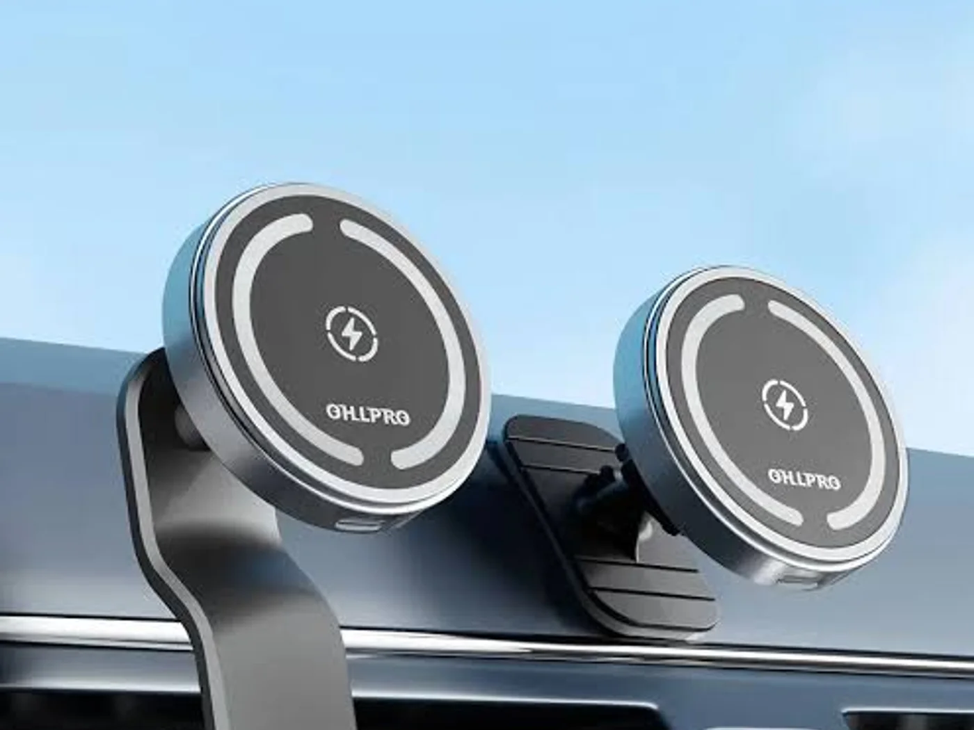 Magnetic dashboard phone mounts for car accessory supply Two magnetic car phone mounts attached near a dashboard air vent.